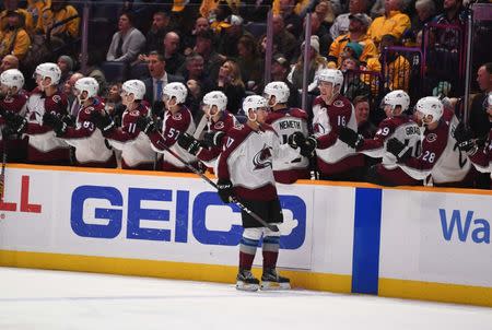 Nov 27, 2018; Nashville, TN, USA; Colorado Avalanche center Tyson Jost (17) celebrates with teammates after scoring during the third period against the Nashville Predators at Bridgestone Arena. Mandatory Credit: Christopher Hanewinckel-USA TODAY Sports