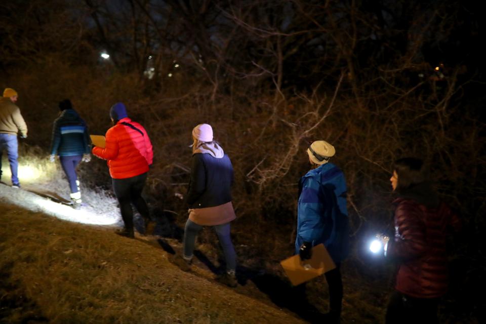 Volunteers and staff with the Homeless Alliance walk along the side of a road Thursday in northwest Oklahoma City during the Homeless Alliance's 2023 Point in Time count of the homeless population.