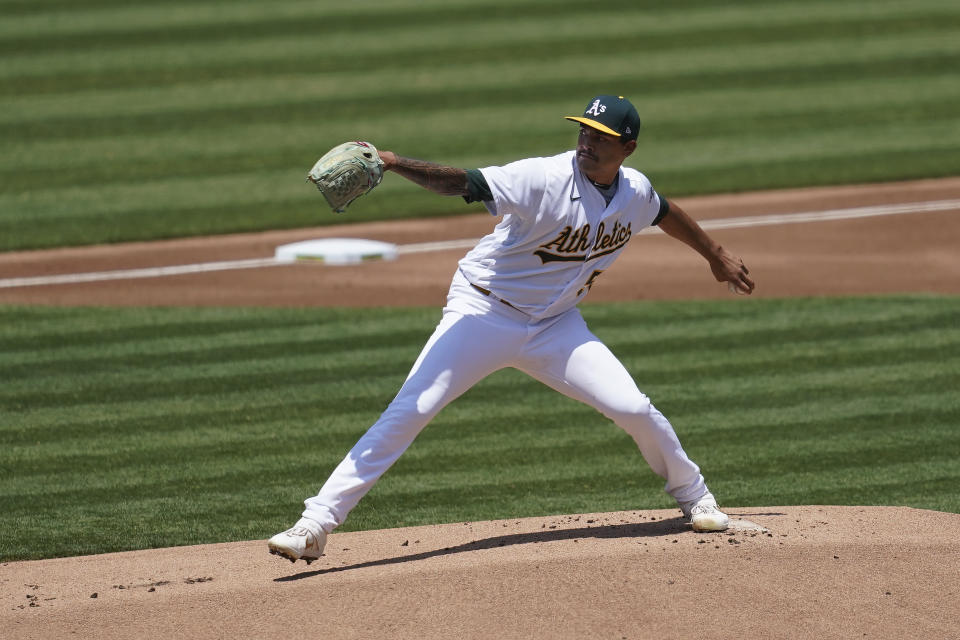 Oakland Athletics pitcher Sean Manaea throws against the Los Angeles Angels during the first inning of a baseball game in Oakland, Calif., Saturday, July 25, 2020. (AP Photo/Jeff Chiu)