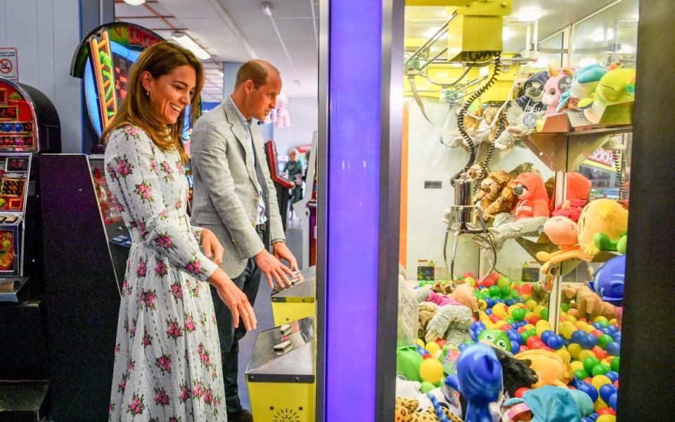 The Duke and Duchess of Cambridge playing 'grab a teddy' together in the arcade - Ben Birchall/PA