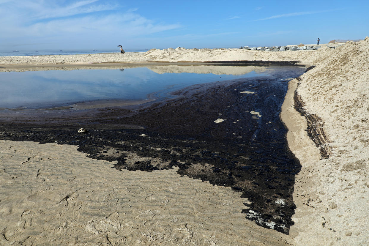 Oil and sea water collect in a tide pool