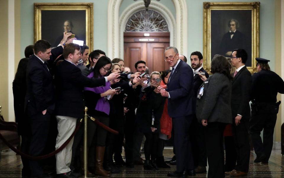 Senate Minority Leader Chuck Schumer talks to reporters - Getty Images North America