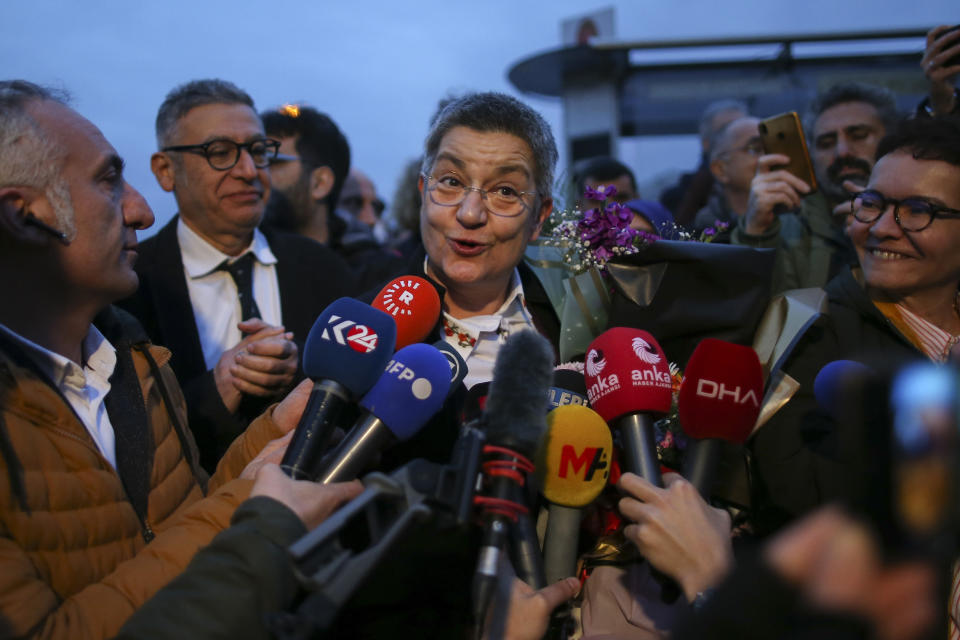 Turkish Medical Association President Dr. Sebnem Korur Fincanci talks to journalists after being released from Bakirkoy women's prison in Istanbul, Turkey, Wednesday, Jan. 11, 2023. A court convicted Fincanci on Wednesday of disseminating "terror organization propaganda" to nearly three years in prison but also ruled to release her from pre-trial detention while she appeals the verdict. (AP Photo/Emrah Gurel)