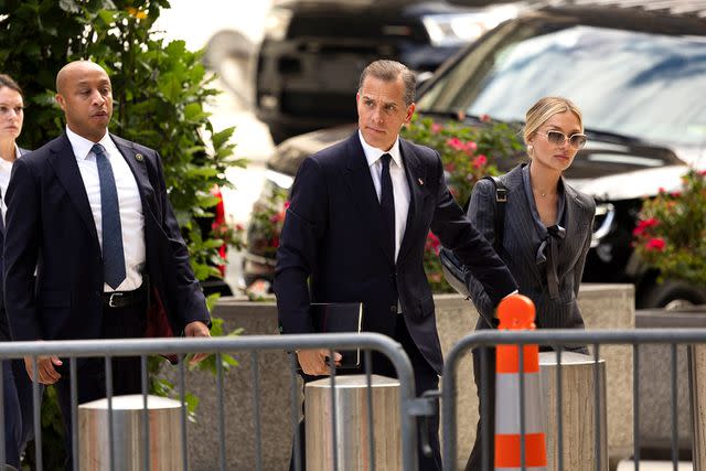 <p>RYAN COLLERD/AFP via Getty Images</p> Hunter Biden arrives for the first day of his federal gun trial on June 3, accompanied by his wife, Melissa Cohen Biden