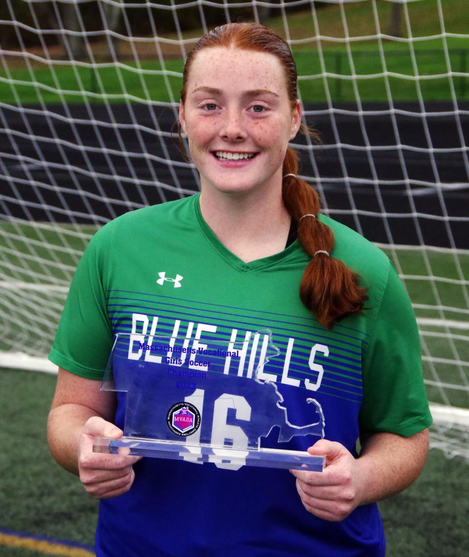 Kathleen Murphy of the Blue Hills poses with the trophy after helping the Warriors claim the state voke championship. Murphy scored twice in the game to tie the program's all-time record for goals with 70.