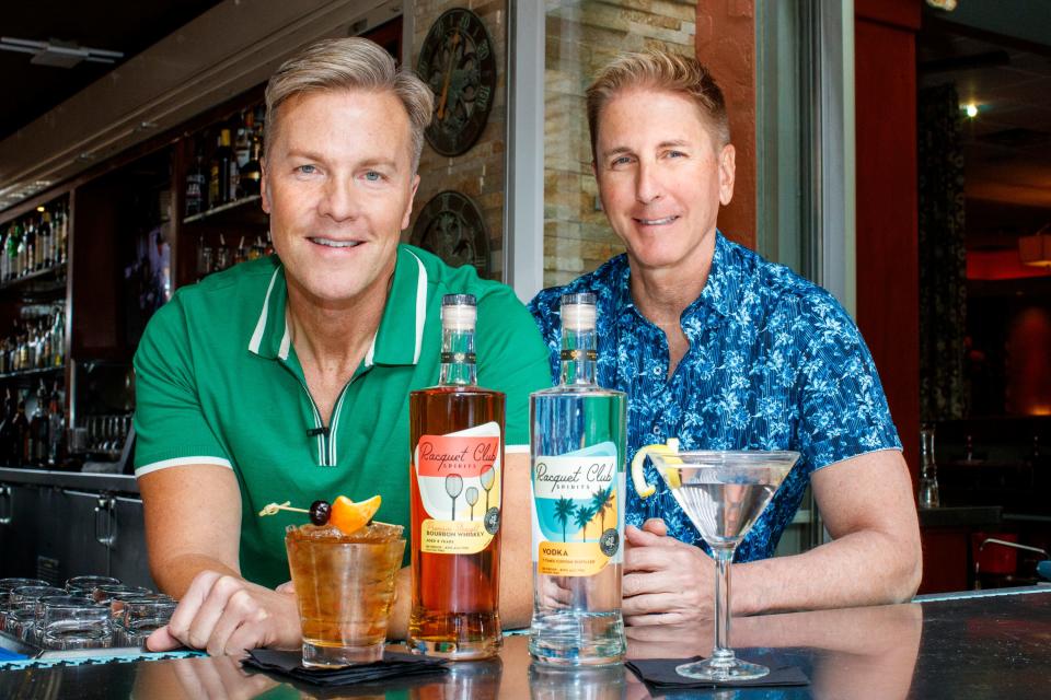 Matthew Winks and Brian Harke, owners of Racquet Club Spirits, display their bourbon whiskey and vodka spirits inside Tropicale Palm Springs in Palm Springs, Calif., on December 10, 2021. 