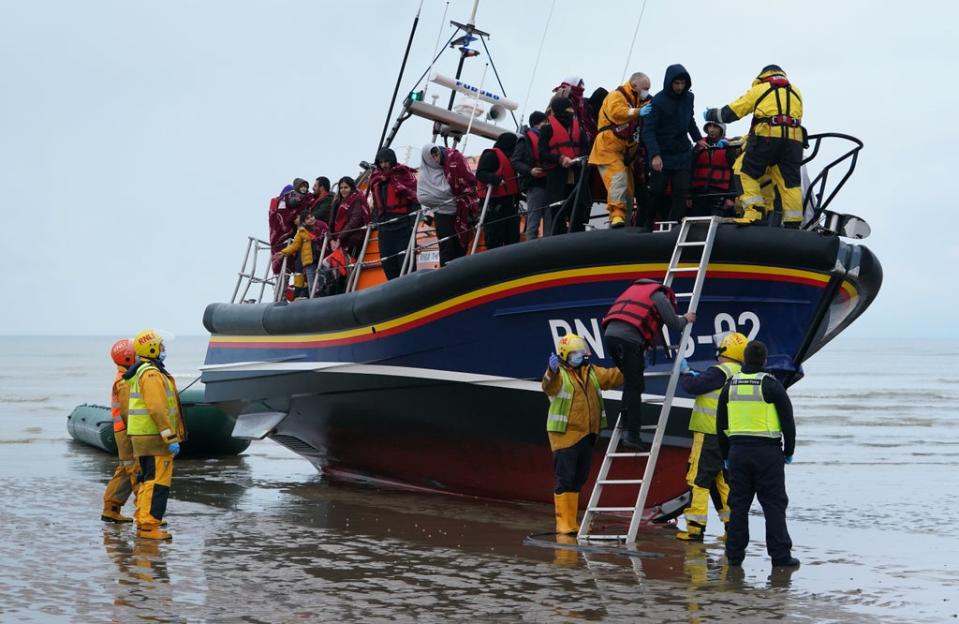 A group of people thought to be migrants are brought in to Dungeness, Kent, by the RNLI on Saturday (Gareth Fuller/PA) (PA Wire)