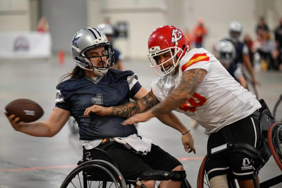 Dallas Cowboys player Zach Blair (1) makes a catch in front of Kansas City Chiefs player Alex Nguyen (40) during the USA Wheelchair Football League Championship, a program of Move United, Tuesday, Feb. 6, 2024 in Dallas, Texas.