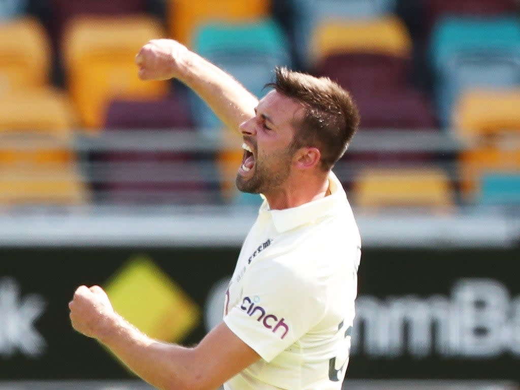 England’s Mark Wood celebrates the wicket of Australia’s Steve Smith during day two of the first Ashes test at The Gabba, Brisbane (Jason O’Brien/PA) (PA Wire)