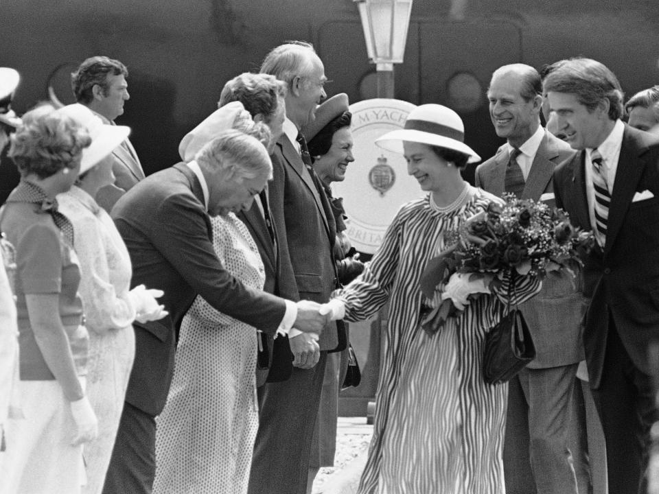 Former US Ambassador to England Walter J. Annenberg bows to Queen Elizabeth in 1976.