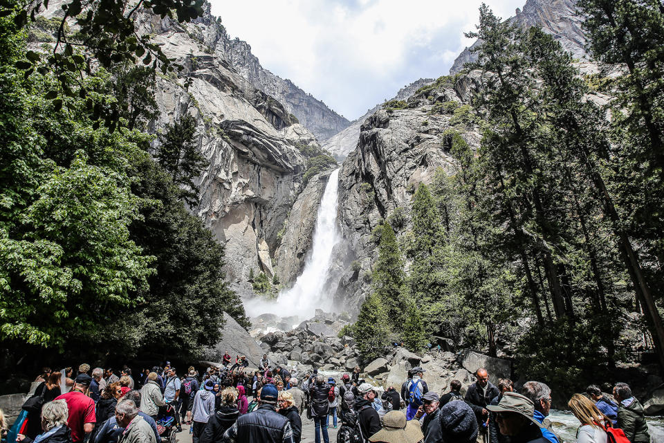 <p>Tourists flock to Lower Yosemite Falls at Yosemite National Park in Yosemite Valley, Calif. (Photo: Eddie Hernandez Photography/iStockphoto/Getty Images) </p>