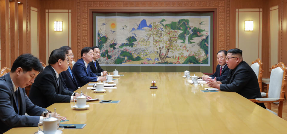 In this Wednesday, Sept. 5, 2018 photo provided on Thursday, Sept. 6, 2018 by South Korea Presidential Blue House via Yonhap News Agency, North Korean leader Kim Jong Un, right, meets with members of South Korean delegation headed by National Security Director Chung Eui-yong, left center, in Pyongyang, North Korea. A South Korean delegation met with North Korean leader Kim Jong Un on Wednesday during a visit to arrange an inter-Korean summit planned for this month and help rescue faltering nuclear diplomacy between Washington and Pyongyang. (South Korea Presidential Blue House/Yonhap via AP)