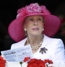 FILE- In this Aug. 7, 2010, file photo, Marylou Whitney watches horse racing from her box seats at Saratoga Race Course in Saratoga Springs, N.Y. Philanthropist, socialite and horse-racing enthusiast Marylou Whitney, known as the "Queen of Saratoga," died on July 19, 2019, at her Saratoga Springs estate after a long illness. She was 93. (AP Photo/Hans Pennink, File)