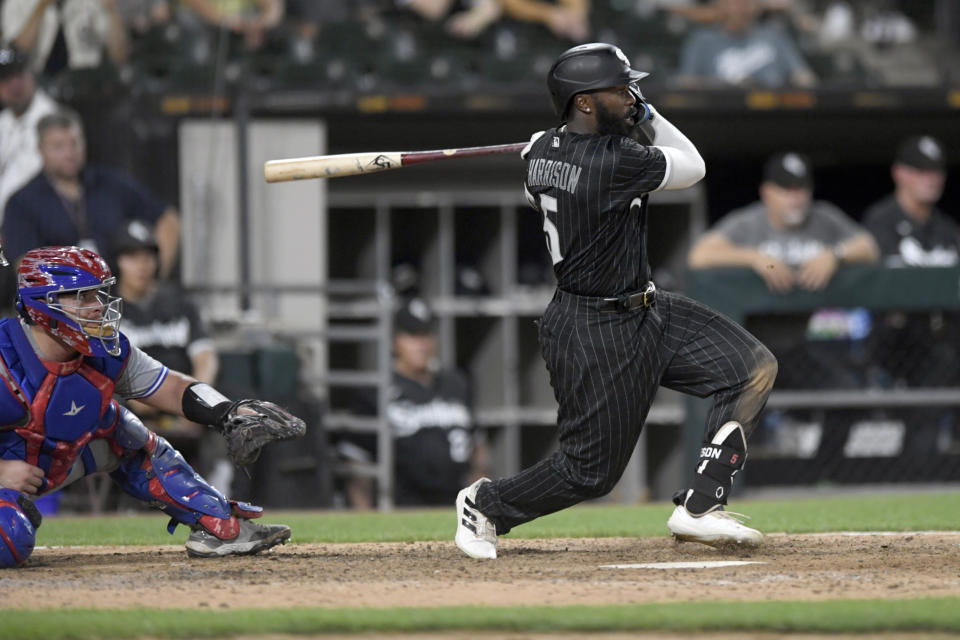 Chicago White Sox's Josh Harrison watches his walk-off RBI single to defeat the Toronto Blue Jays 7-6 in twelve innings of a baseball game Tuesday, June 21, 2022, in Chicago. (AP Photo/Paul Beaty)