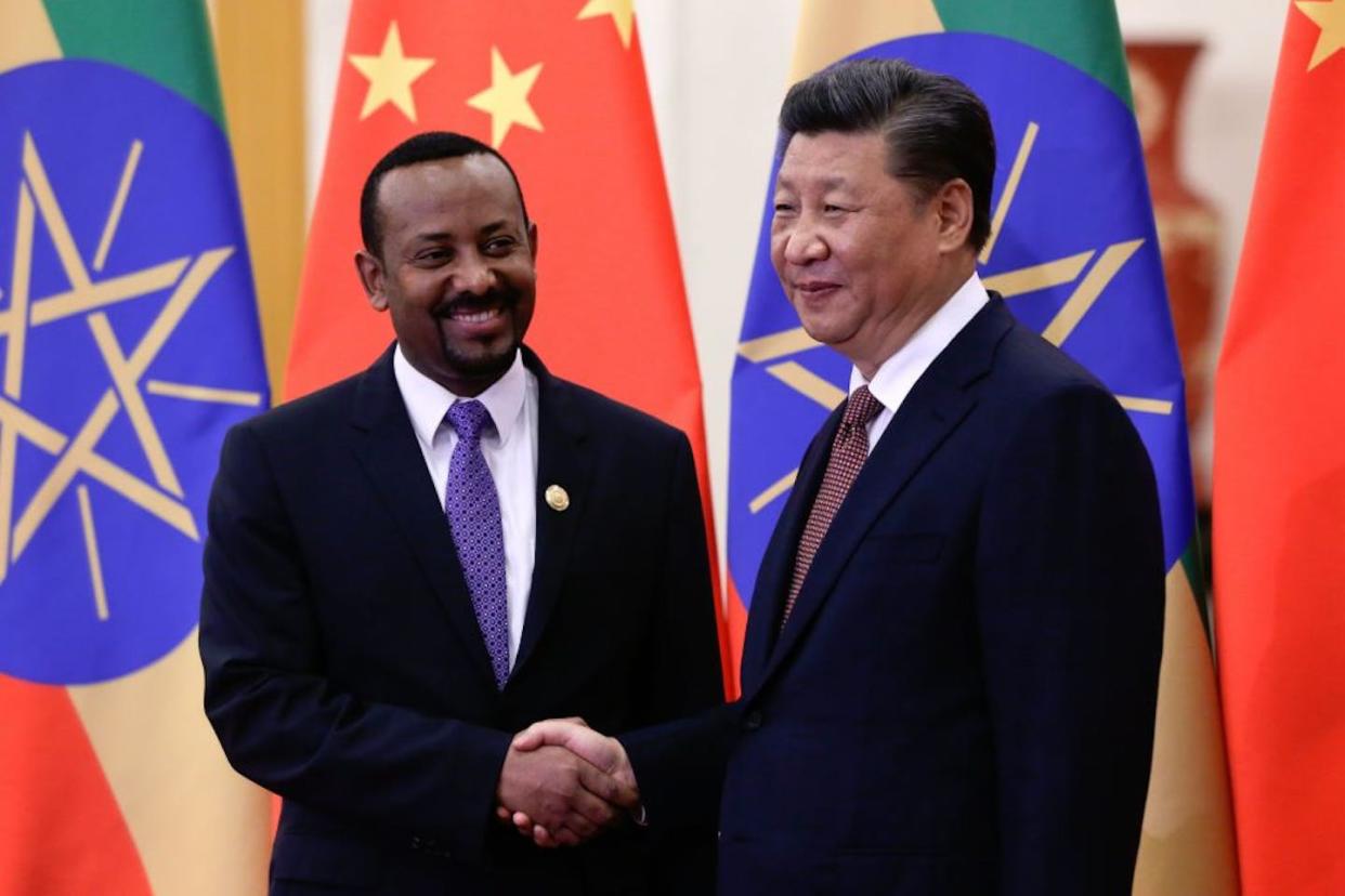 Ethiopia's <span class="caas-xray-inline-tooltip"><span class="caas-xray-inline caas-xray-entity caas-xray-pill rapid-nonanchor-lt" data-entity-id="Abiy_Ahmed" data-ylk="cid:Abiy_Ahmed;pos:1;elmt:wiki;sec:pill-inline-entity;elm:pill-inline-text;itc:1;cat:OfficeHolder;" tabindex="0" aria-haspopup="dialog"><a href="https://search.yahoo.com/search?p=Abiy%20Ahmed" data-i13n="cid:Abiy_Ahmed;pos:1;elmt:wiki;sec:pill-inline-entity;elm:pill-inline-text;itc:1;cat:OfficeHolder;" tabindex="-1" data-ylk="slk:Prime Minister Abiy Ahmed;cid:Abiy_Ahmed;pos:1;elmt:wiki;sec:pill-inline-entity;elm:pill-inline-text;itc:1;cat:OfficeHolder;" class="link ">Prime Minister Abiy Ahmed</a></span></span> (left) with China's President Xi Jinping in Beijing in 2018. Andy Wong / AFP via Getty Images