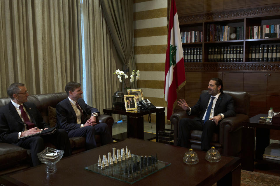 U.S. Undersecretary of State for Political Affairs David Hale, center left, meets with with former Lebanese Prime Minister Saad Hariri in downtown Beirut, Lebanon, Friday, Dec. 20, 2019. Hale is the most senior foreign diplomat to visit the country since the political crisis. (AP Photo/Maya Alleruzzo)