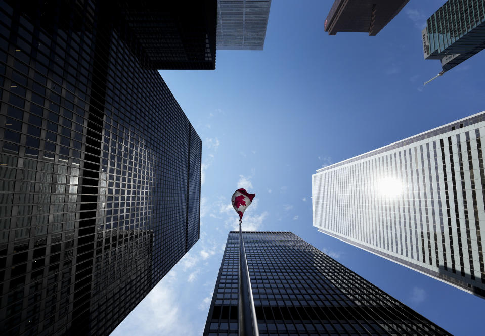The head of Canada's banking regulator says he's ramping up scrutiny of money laundering as risks increase. The Bay Street Financial District is shown with the Canadian flag in Toronto on Friday, August 5, 2022.THE CANADIAN PRESS/Nathan Denette