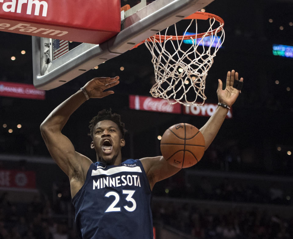 Despite what it may seem like, Jimmy Butler is not yawning from exhaustion here. (AP)