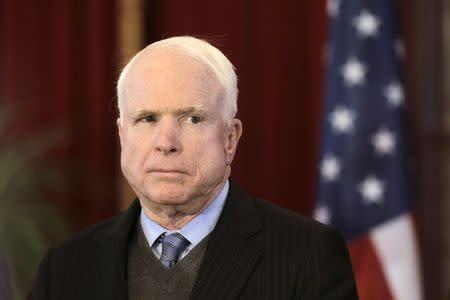 U.S. Senator John McCain listens during a news conference in Riga in this April 15, 2014 file photo. REUTERS/Ints Kalnins/Files