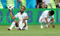 <p>Saudi Arabia’s Abdullah Otayf looks dejected after Saudi Arabia were knocked out of the World Cup </p>