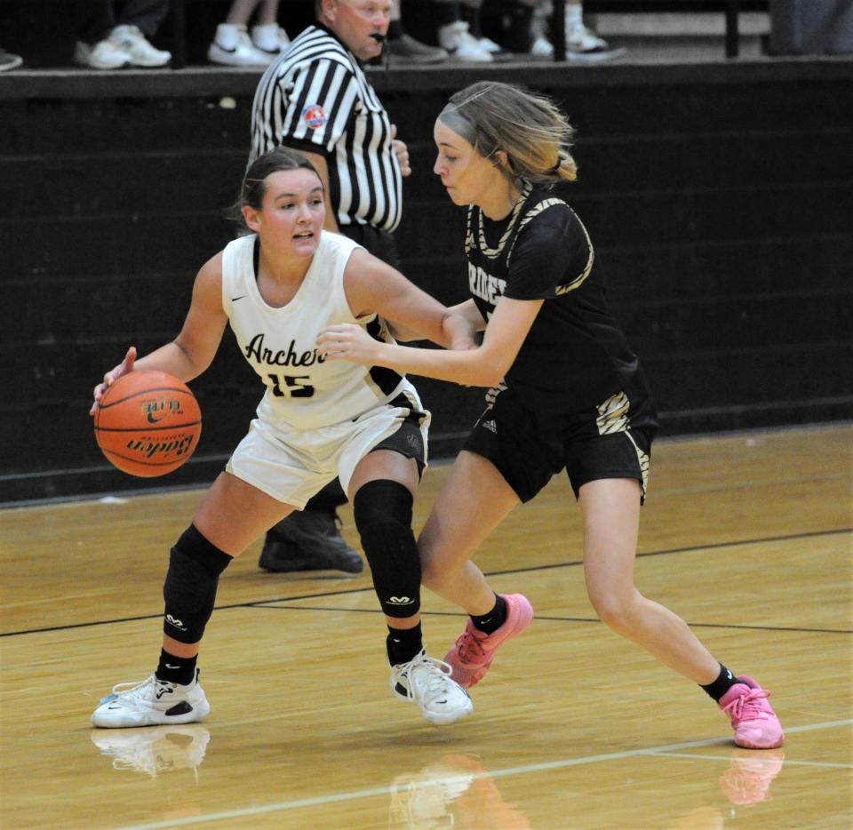 Archer City's Aspyn Huseman looks to pass around Rider's Kylie Flippin during the 2022 Maskat Shrine Annual Oil Bowl Classic girls basketball game at Rider on Friday, June 17, 2022.