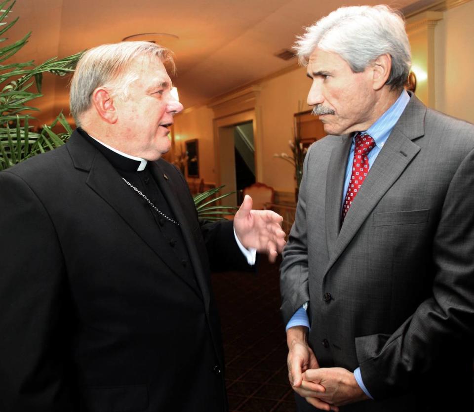 Miami Archbishop Thomas Wenski, left, chats with Jacob Solomon, right, president and CEO of the Greater Miami Jewish Federation, at a luncheon at the Miami Shores Country Club on Tuesday, Oct. 11, 2011.