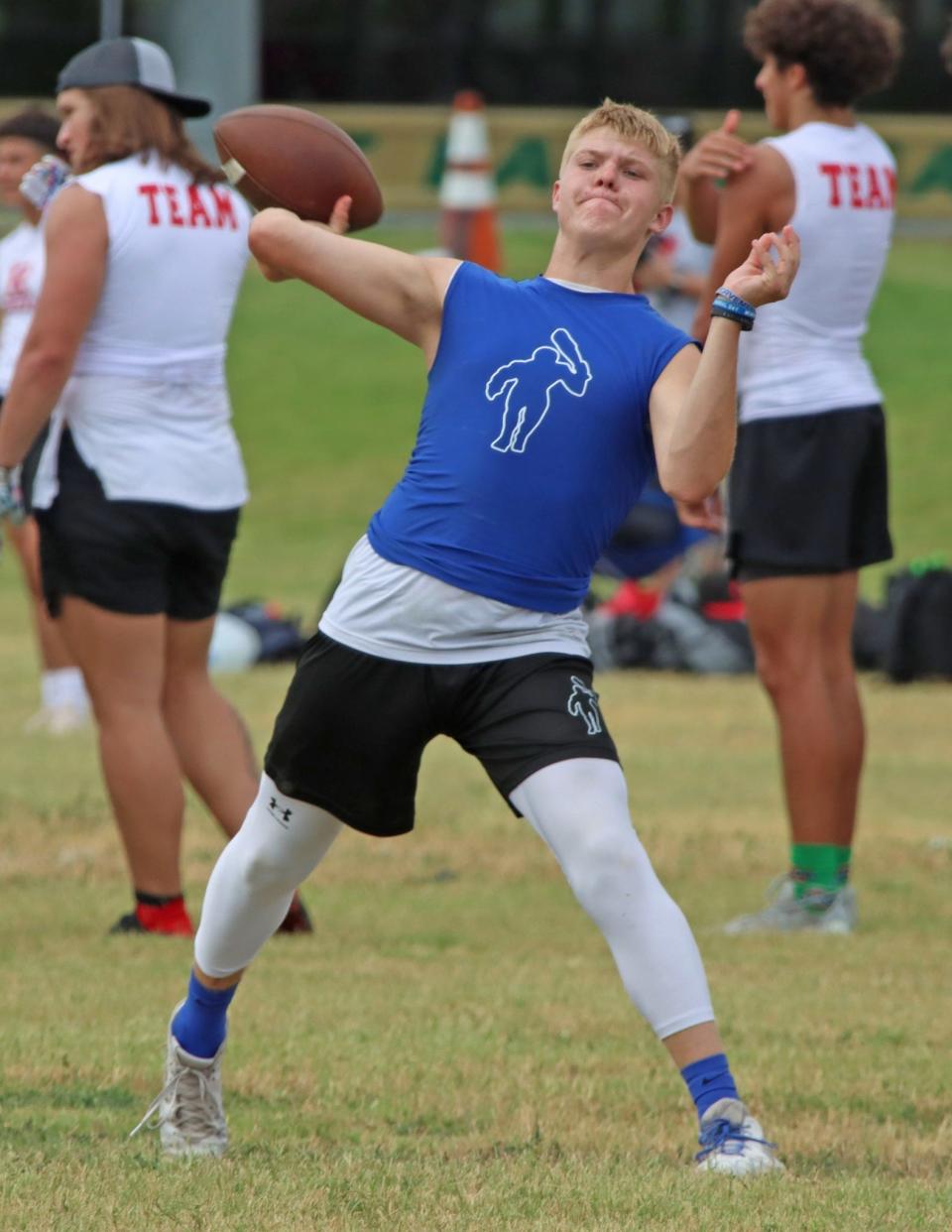 Carlsbad Cavemen quarterback Kason Perez gets ready to fire a pass during a 7-on-7 camp July 14, 2023 in Roswell.