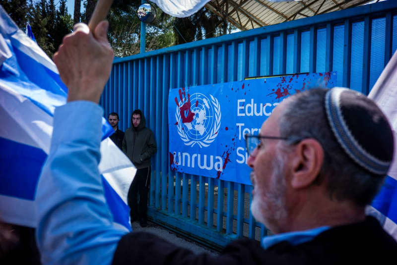 Israeli Right-wing activists take part in a protest as they block the entrance to the United Nations Relief and Works Agency for Palestine Refugees (UNRWA) office. Ilia Yefimovich/dpa