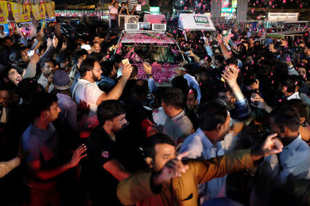 Maryam Nawaz, the daughter of Pakistan's former Prime Minister Nawaz Sharif, rides in a car being showered with rose petals at a rally in Lahore, Pakstan September 9, 2017. REUTERS/Drazen Jorgic