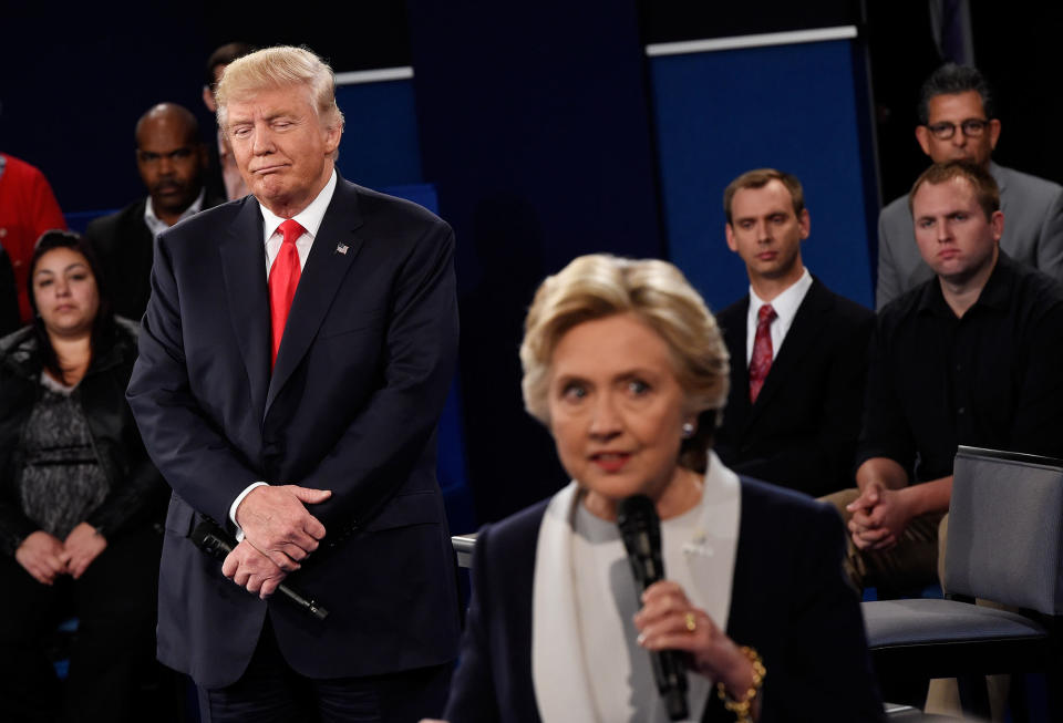 <p>Hillary Clinton speaks as Republican presidential nominee Donald Trump listens during the town hall debate at Washington University on Oct. 9, 2016 in St Louis, Mo. (Photo: Saul Loeb-Pool/Getty Images) </p>