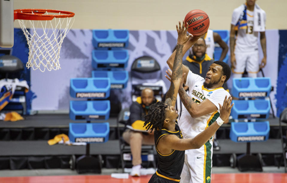 Appalachian State forward RJ Duhart (4), left, tries to block a shot by Norfolk State forward J.J. Matthews (15) during the second half of a First Four game in the NCAA men's college basketball tournament, Thursday, March 18, 2021, in Bloomington, Ind. (AP Photo/Doug McSchooler)