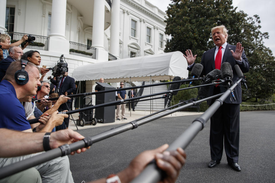 President Donald Trump speaks with reporters on the South Lawn of the White House, Monday, Oct. 8, 2018, in Washington. (AP Photo/Evan Vucci)