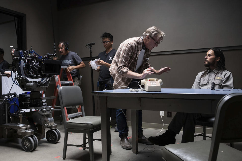 This image released by Warner Bros. Pictures shows director/writer/producer John Lee Hancock, center, and Jared Leto on the set of "The Little Things." (Nicola Goode/Warner Bros. Pictures via AP)