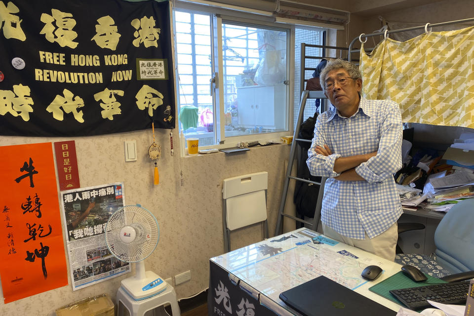 Lam Wing-Kee, a Hong Kong bookstore owner who fled to Taiwan in 2019, stands near a bunk bed during an interview inside his bookstore in Taipei, Taiwan on June 8, 2022. Coming to Taiwan was a logical step for Lam, a Hong Kong bookstore owner who was held by police in China for five months for selling sensitive books about the Communist Party. An island just 400 miles from Hong Kong, Taiwan is close not just geographically but also linguistically and culturally. (AP Photo/Johnson Lai)