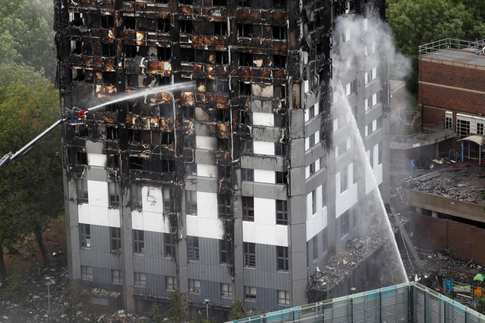 <p>Water continues to be sprayed onto the tower block that was destroyed in a fire disaster, in north Kensington, West London, Britain, June 15, 2017. (Photo: Peter Nicholls/Reuters) </p>