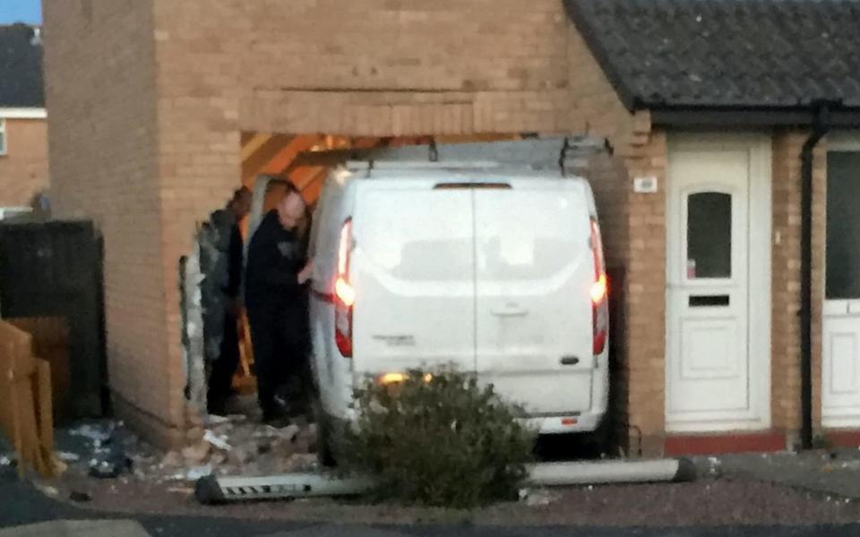 The van was left embedded in the semi-detached house in a cul-de-sac in Clevedon, North Somerset - SWNS.com