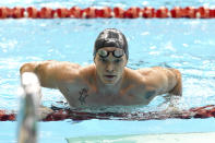 Cody Simpson rests after swimming in the Men's 100-meter Freestyle Heats at the Australian Swimming Trials for the Tokyo Olympic and Paralympic qualification at the SA Aquatic and Leisure Centre in Adelaide, Australia, Tuesday, June 15, 2021. Olympic champion Kyle Chalmers and singer Simpson were listed side-by-side in the promotional billing for a documentary series series ahead of Australia’s Olympic swimming trials. (Dave Hunt/AAP Image via AP)