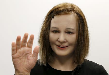 Nadine, a humanoid created by Nanyang Technological University's (NTU) Professor Nadia Thalmann and her team, reacts to the presence of people during an interview with Reuters at their campus in Singapore March 1, 2016. REUTERS/Edgar Su