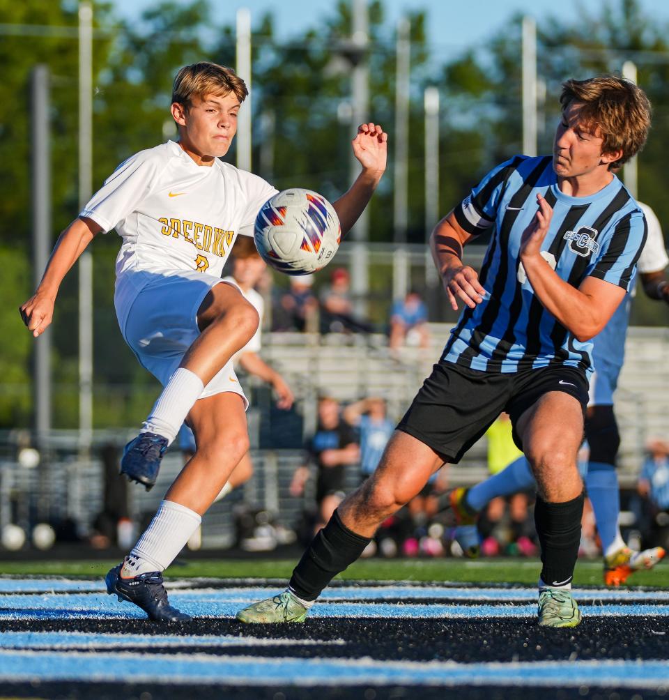 Speedway Sparkplugs Joey Heaviland (9) kicks the ball against Cascade Cadets Ari Moore (10) on Thursday, Aug. 31, 2023, during the game at Cascade High School in Clayton. The Speedway Sparkplugs defeated the Cascade Cadets, 2-1.