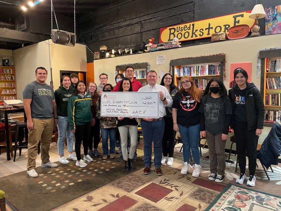 The Aberdeen Area Community Foundation made a grant of $2,500 to the Presentation College Diversity Club to support bringing Jackie Bird and Family to present a program of traditional and contemporary Native American singing, dancing and storytelling to Aberdeen for a free performance for Native American Heritage Month. The project was a partnership among the Presentation Diversity Club, Northern State University Native American Student Association and Aberdeen Central High School Indian Education Office & Native American Student Association. Pictured are, back row row, from left to right: Nicholas Delgado and Gabby Lopez (Presentation students); Brody Treetop (Central); Sharmayne Hardy (Presentation); Hannah McElhany (Tutor, Central); Grant Bourelle (Central); Braelle Antonio (Central); Dakota Redwing (Presentation); Gordon Treetop (Central Indian Education Program Coordinator); Kaelynn Hanley, Taelynn Sainz, Elizabeth Martin, and Leila Bosque (Central). Front, from left: Megan Biegler and Heath Johnson (AACF board members).