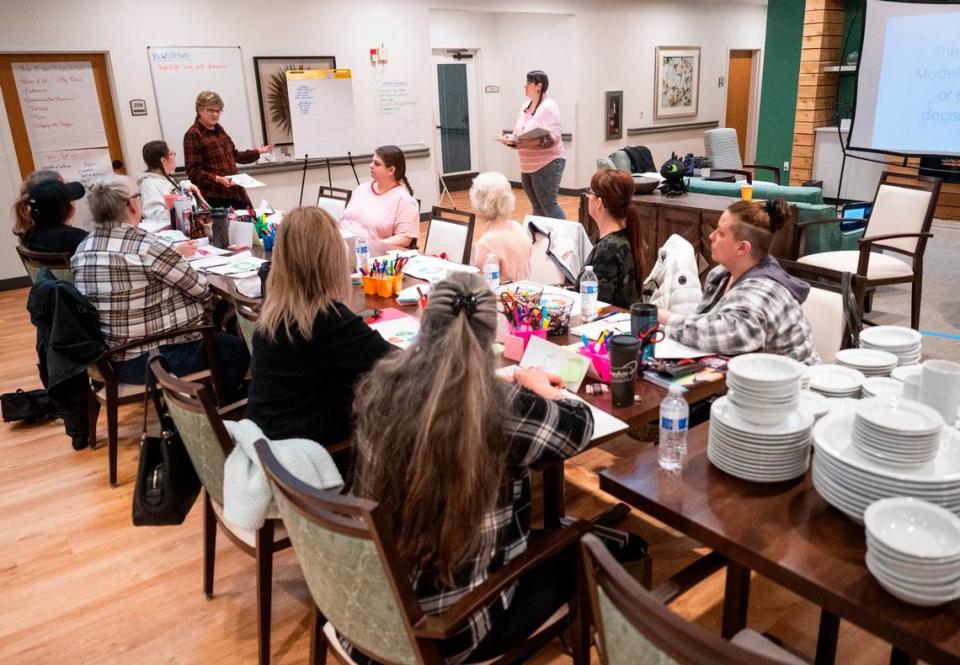 Staff members attend a training in preparation for the Mustard Seed Project, the first assisted living facility on the Key Peninsula, to open its doors soon in Lakebay, Wash. on Jan, 25, 2023.