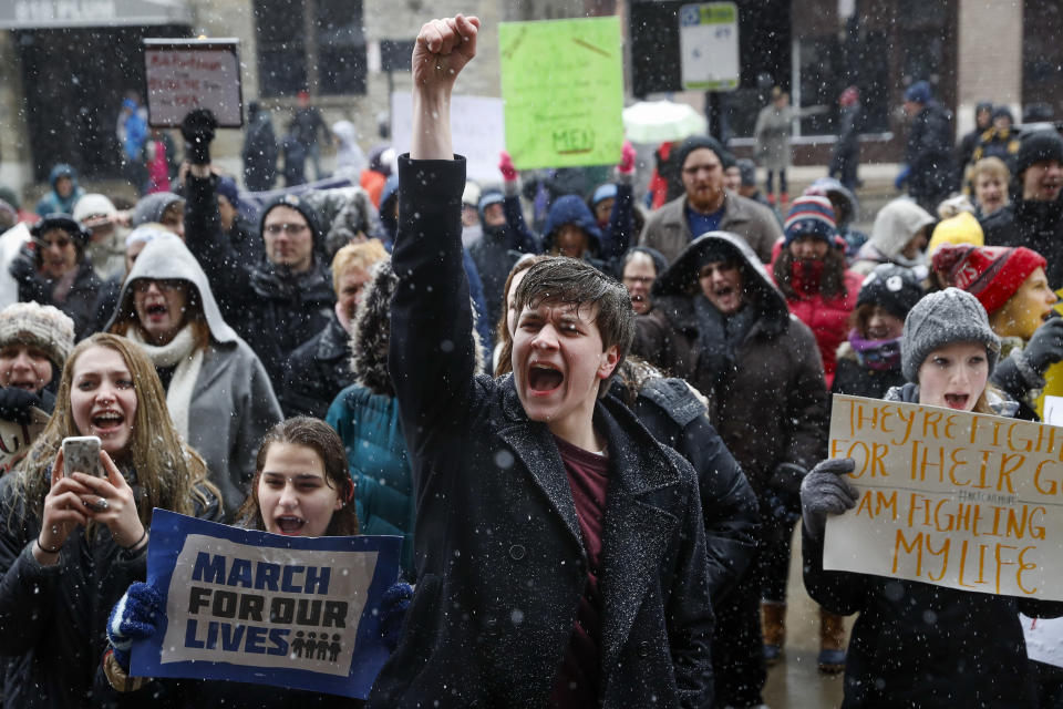 <p>John Collins, 19, a University of Cincinnati student, cheers outside city hall during the “March for Our Lives” protest for gun legislation and school safety in Cincinnati. (AP Photo/John Minchillo) </p>