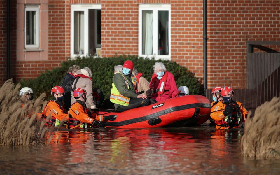 Care home residents were evacuated after the River Weaver burst its banks  - Reuters