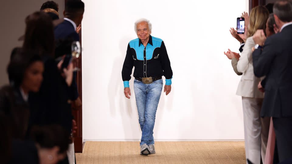 Taking his bow at the end of the runway, designer Ralph Lauren brought his latest collection back to "timeless" roots in fashion and Americana — and back to his studio. - Charly Triballeau/AFP/Getty Images