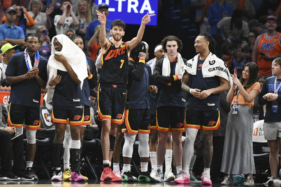 Oklahoma City Thunder forward Chet Holmgren (7) swings as the clock runs down in the second half of an NBA basketball game against the Dallas Mavericks, Sunday, April 14, 2024, in Oklahoma City.  (AP Photo/Kyle Phillips)