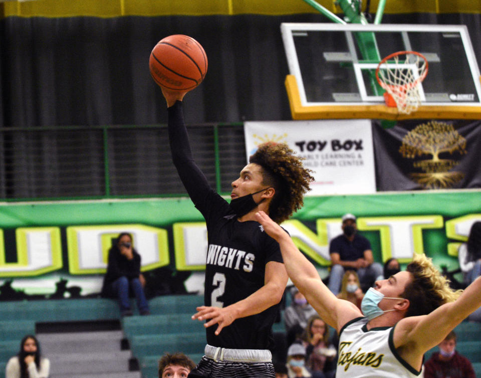 Organ Mountain's Dorian Rivera gets by Mayfield's Noah Alvarez during Friday night's district game.