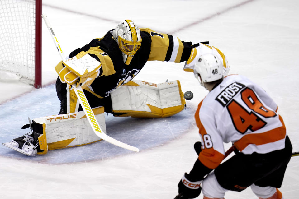 Pittsburgh Penguins goaltender Casey DeSmith (1) stretches to block a shot during the first period of an NHL hockey game against the Philadelphia Flyers in Pittsburgh, Sunday, April 2, 2023. (AP Photo/Gene J. Puskar)