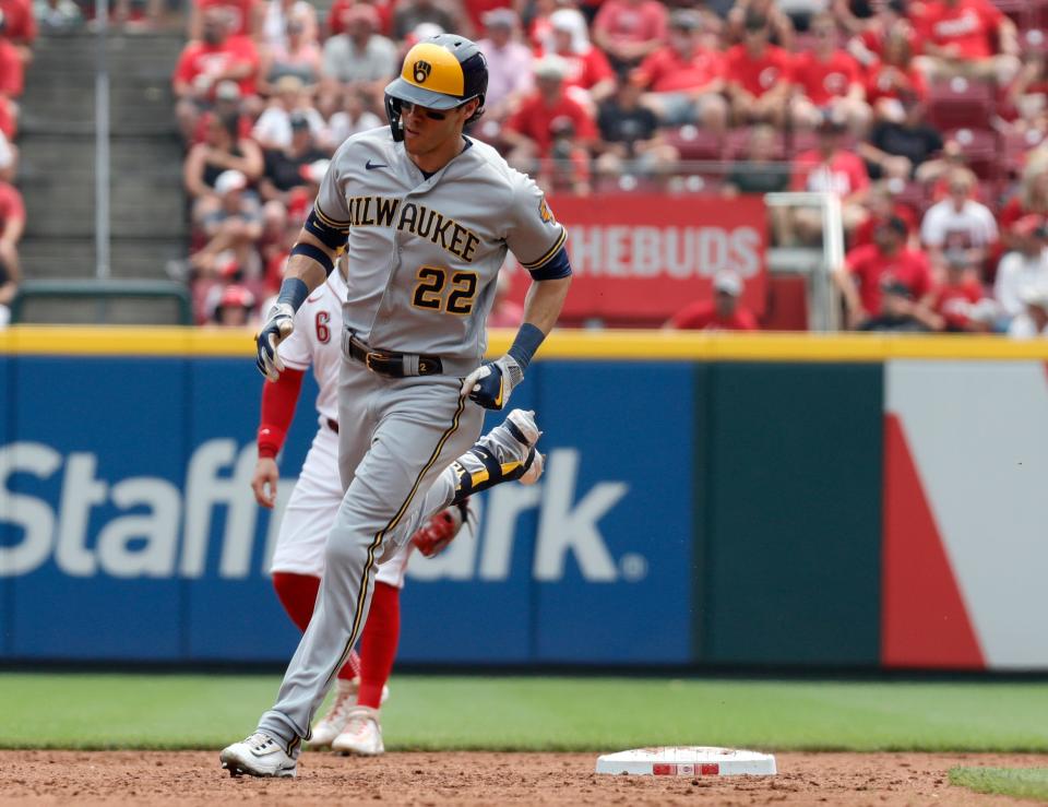 Brewers leftfielder Christian Yelich rounds the bases after smacking a solo home run against theReds during the third inning Sunday at Great American Ball Park.