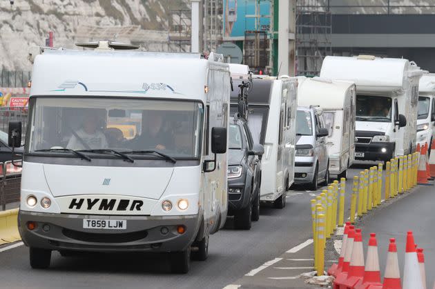 A line of mobile homes and caravans leaving the Port of Dover, Kent, as travellers try to get back from France to avoid quarantine restrictions.