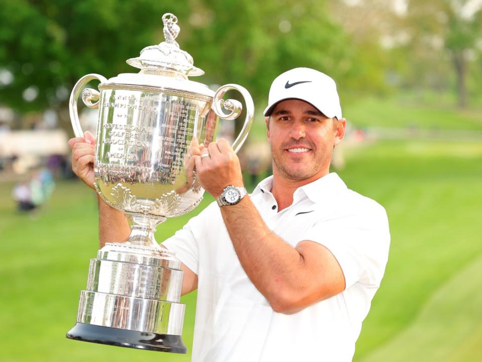 Brooks Koepka lifts the Wanamaker Trophy for a third time (Getty Images)